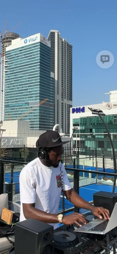 Professional DJ mixing tracks at a Dubai rooftop venue